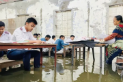 কক্ষে হাঁটু পানি, বেঞ্চে পা তুলে পরীক্ষা দিলো এসএসসি পরীক্ষার্থীরা